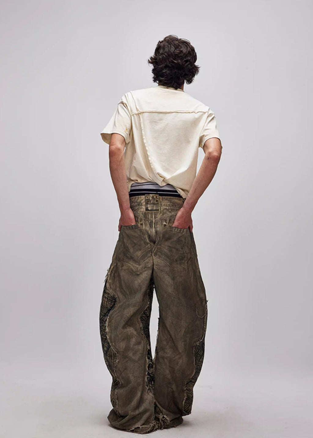FLYERRER 24AW Original "Mutation" Series Irregular Ripped Patchwork Curved Leg Pants FR213